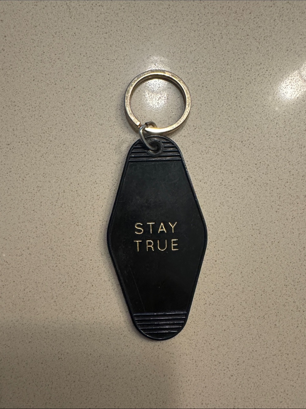 Black 'Stay True' Keychain with Gold Lettering